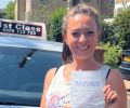 Lisa with Driving test pass certificate